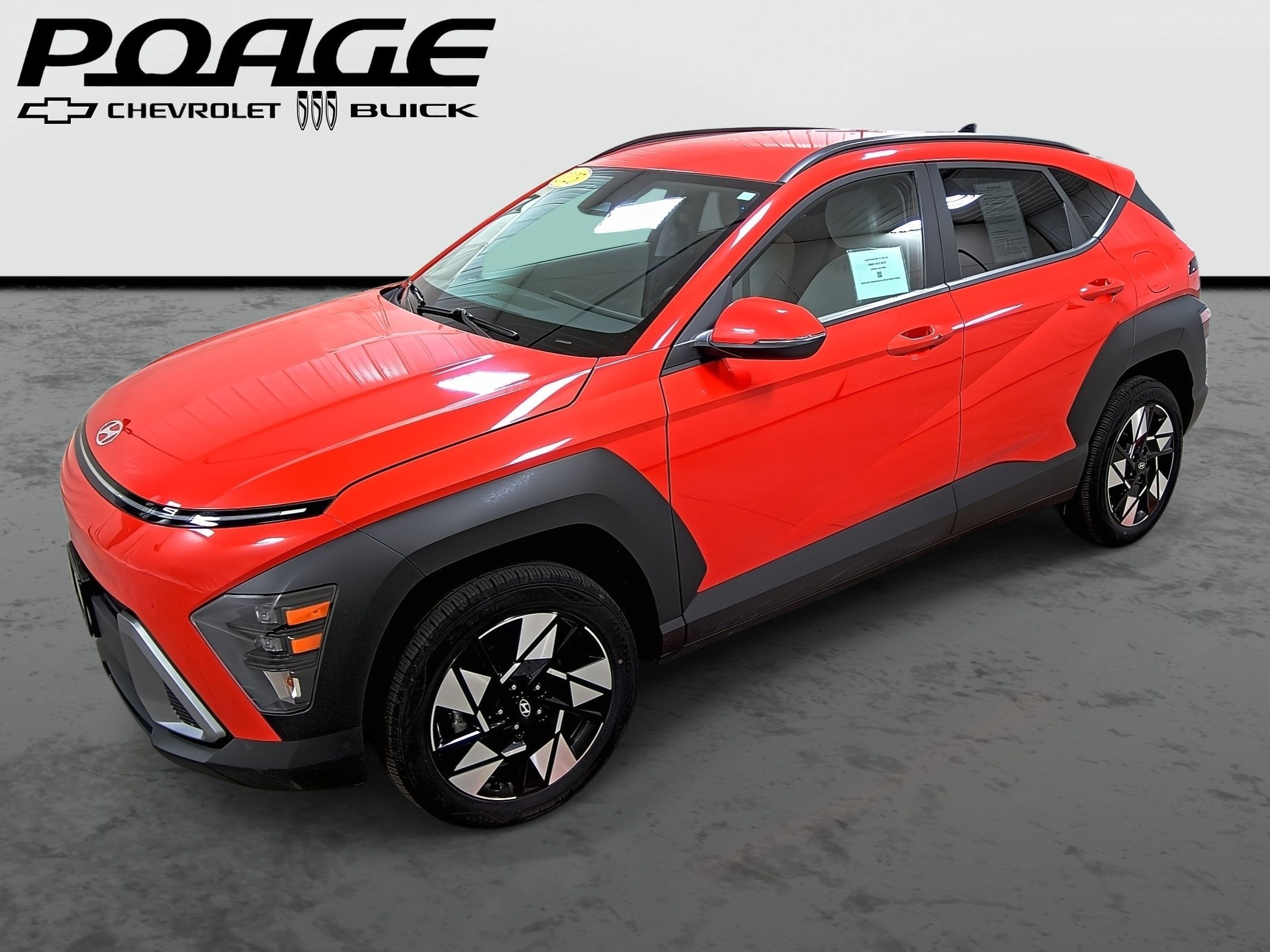 2025 Hyundai Kona SEL in Orange — front three-quarter view