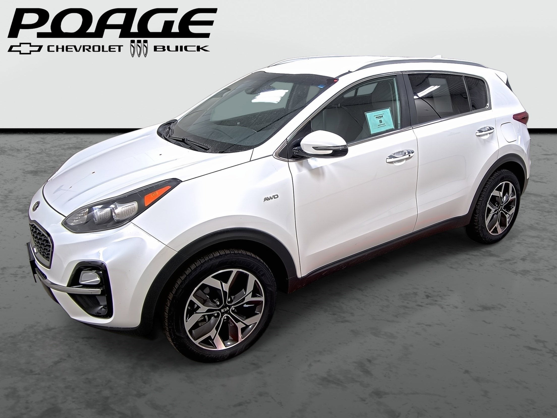 2020 Kia Sportage EX in White — front three-quarter view